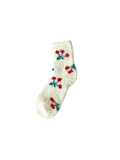Ivory fuzzy crew sock with repeating red cherry motifs
