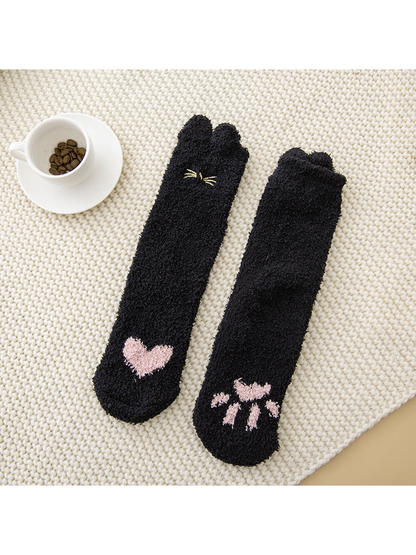 Black fuzzy cat crew socks with pink heart and paw motifs