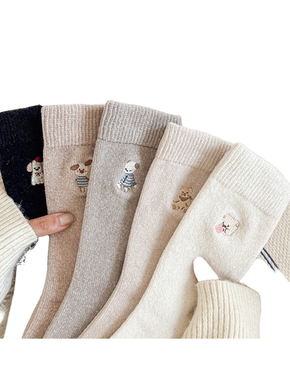 Five colors of embroidered crew socks displayed together
