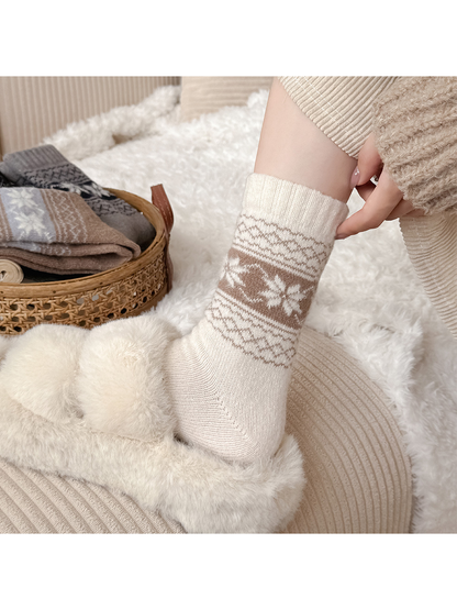 Ivory snowflake sock styled with a plush slipper