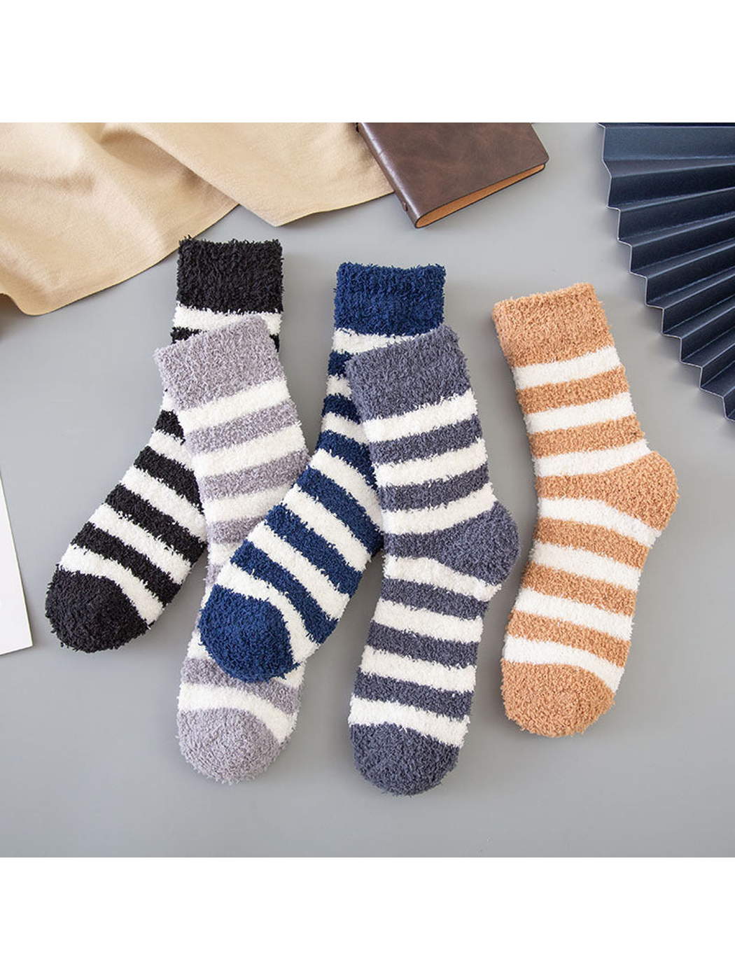 Five striped fuzzy crew sock colors displayed together