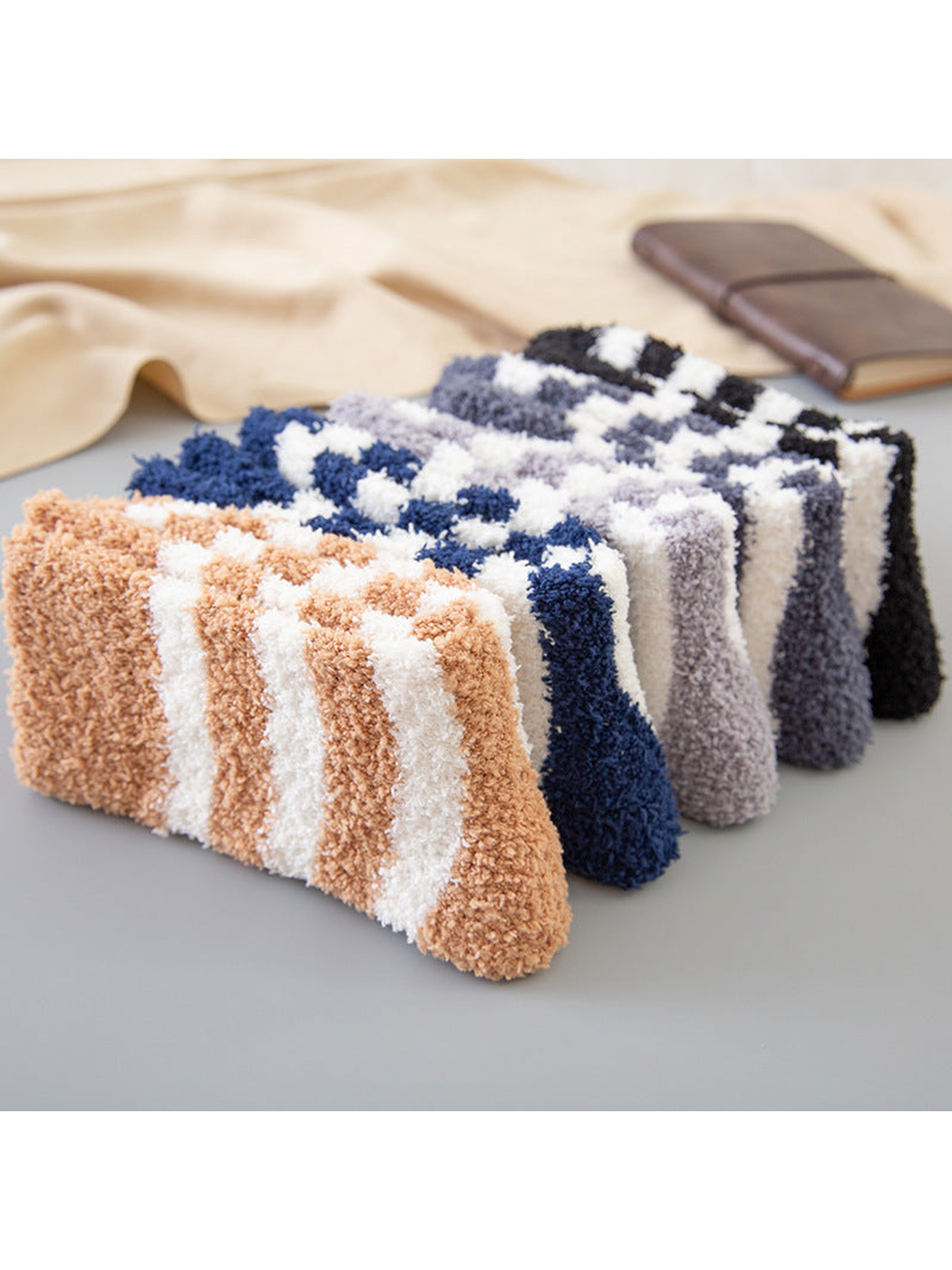 Close-up of fuzzy striped socks in five colors