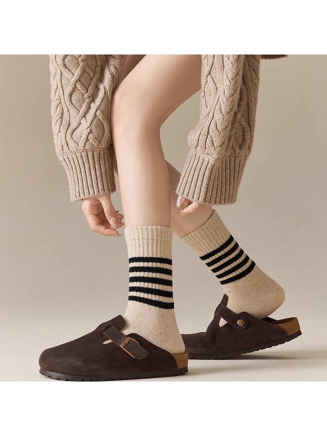 Beige striped crew socks styled with brown clogs