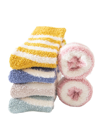 Folded and rolled fuzzy striped socks in assorted colors