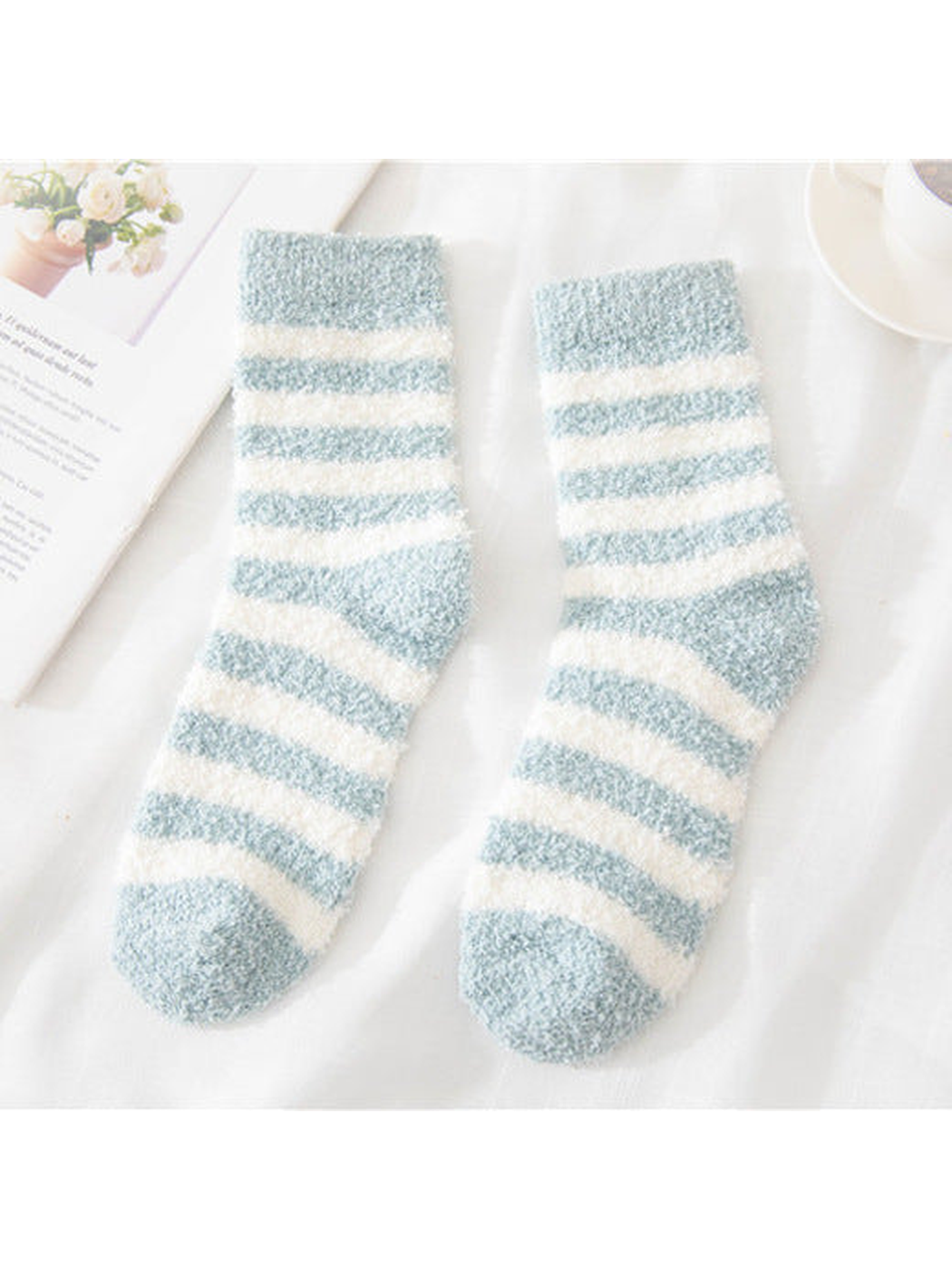 Light blue fuzzy socks with cream stripes