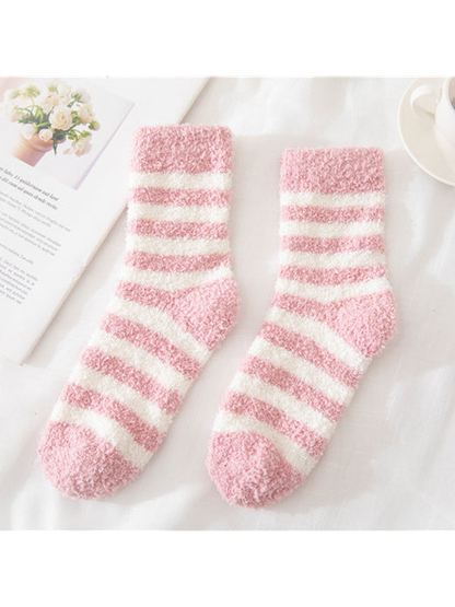 Light pink fuzzy socks with cream stripes