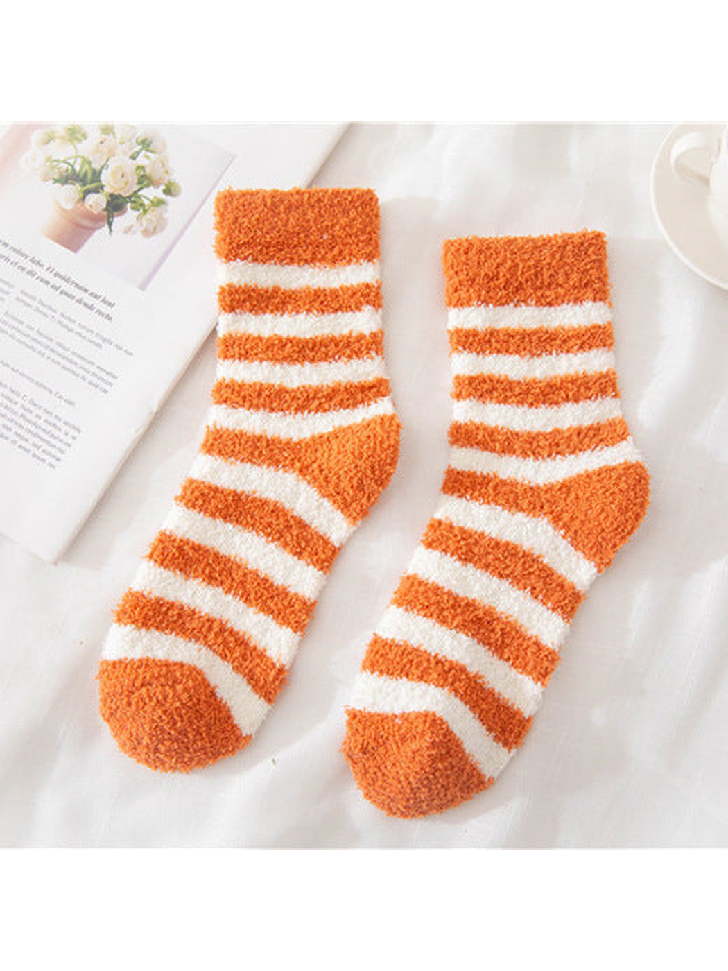 Orange fuzzy socks with cream stripes