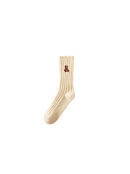 Cream ribbed crew sock with an embroidered teddy bear in a red outfit
