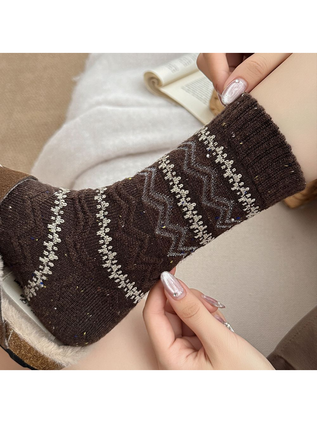 Close-up of the dark brown sock cuff and geometric knit pattern