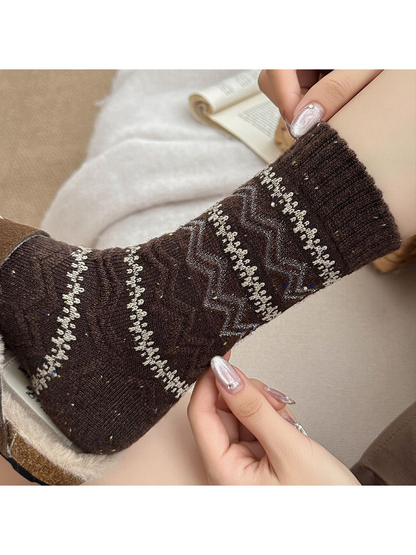 Close-up of the dark brown sock cuff and geometric knit pattern