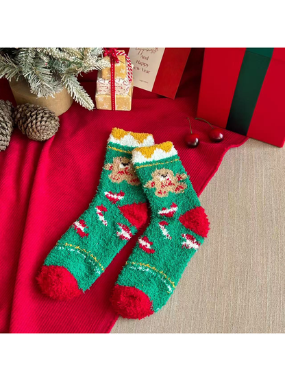 Green fuzzy crew socks with gingerbread motifs and red toes