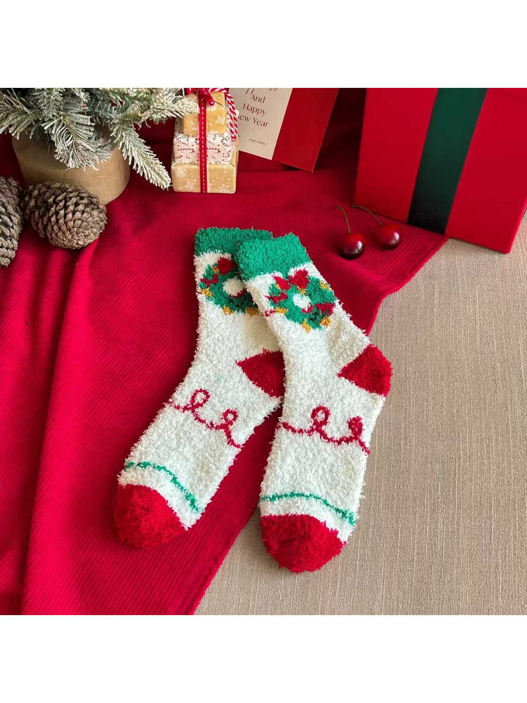 Ivory fuzzy crew socks with holiday wreath motifs and red toes
