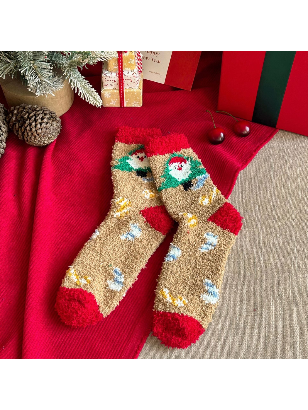 Beige fuzzy crew socks with Santa tree motifs and red cuffs and toes