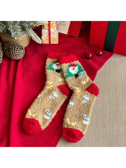 Beige fuzzy crew socks with Santa tree motifs and red cuffs and toes