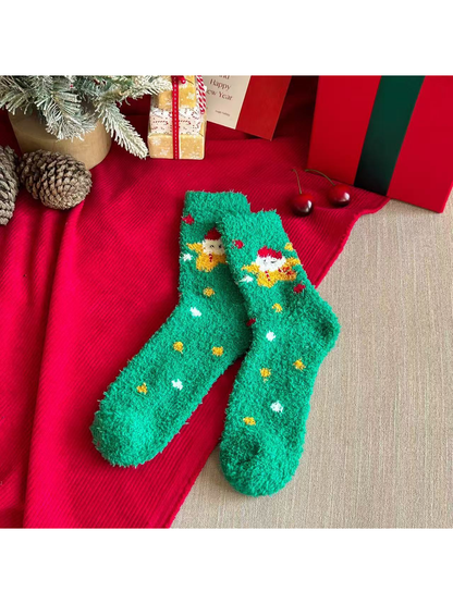 Green fuzzy crew socks with Santa motifs and scattered stars
