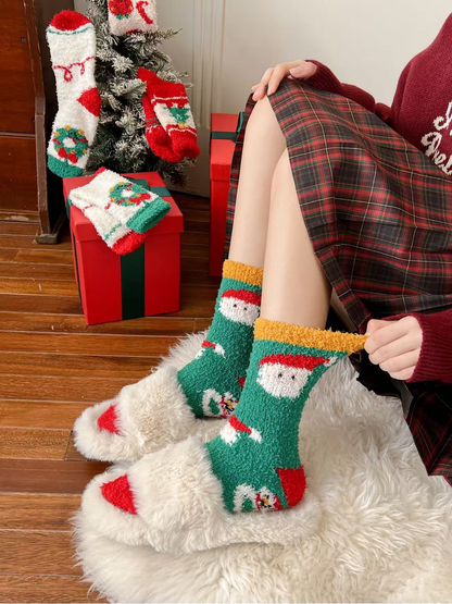 Green Santa-pattern fuzzy crew socks worn in a festive indoor setting