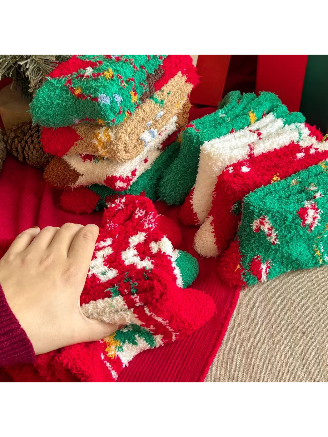 Close-up of the dense fuzzy looped texture across assorted Christmas sock designs