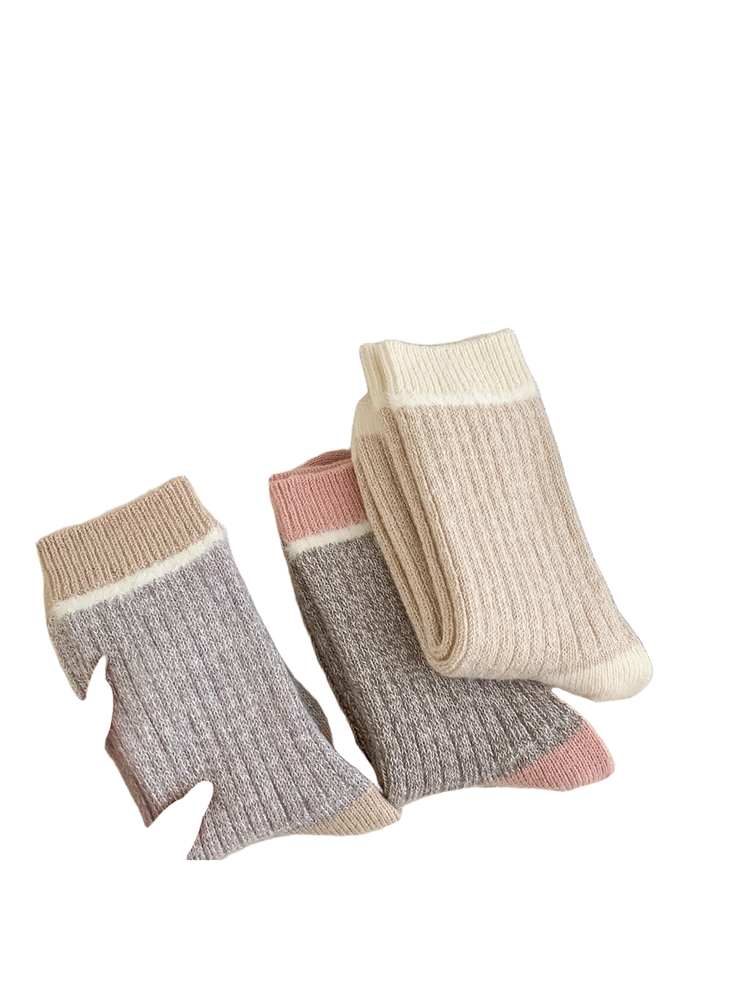 Assorted color-block crew socks arranged on a textured neutral surface