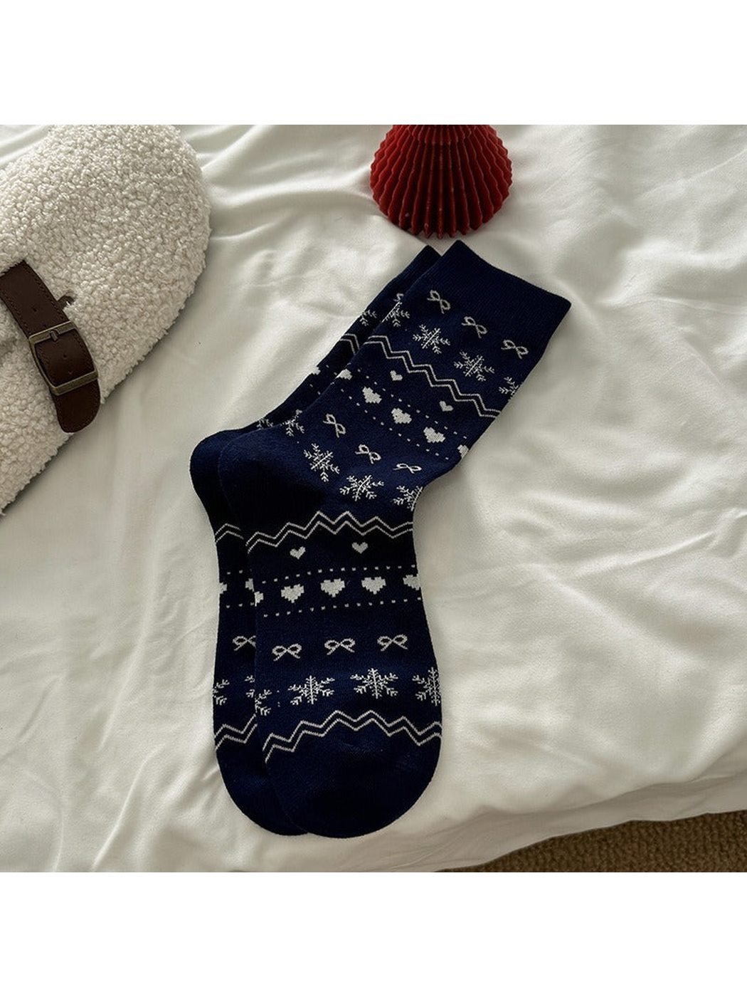 Navy crew socks with snowflake, heart, bow and zigzag motifs