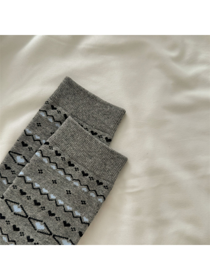 Close-up of the gray sock ribbed cuff and patterned body
