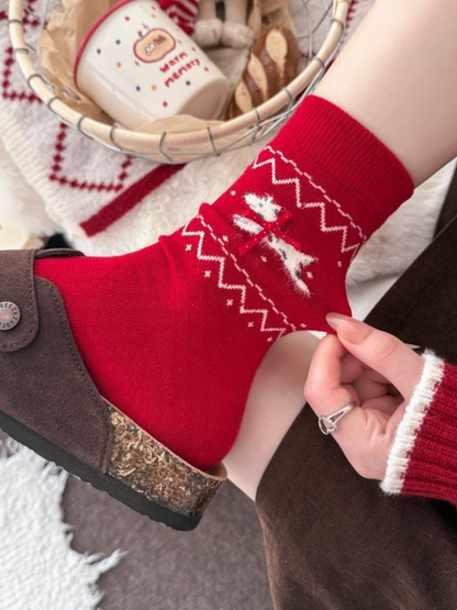 Red dog-and-bow crew sock worn with a brown clog