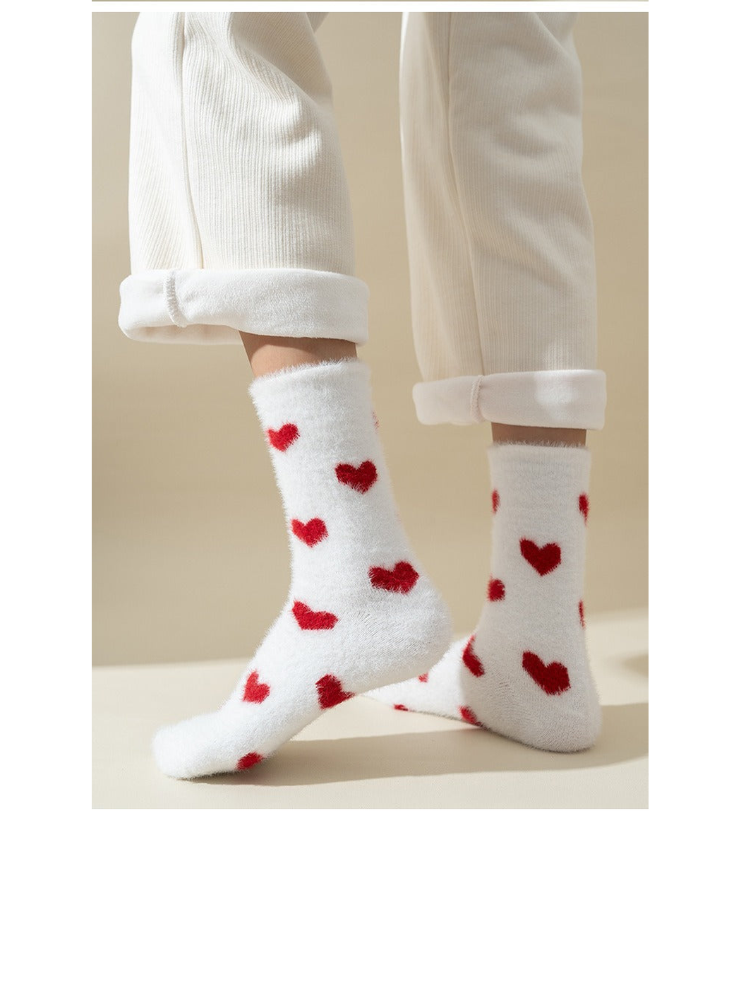 White fuzzy crew socks with scattered red heart motifs