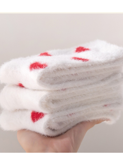 Close-up of the fuzzy white texture and red heart pattern
