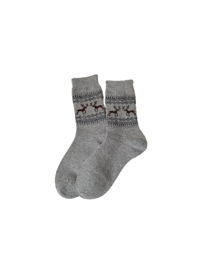 Light gray crew socks with brown deer and geometric bands
