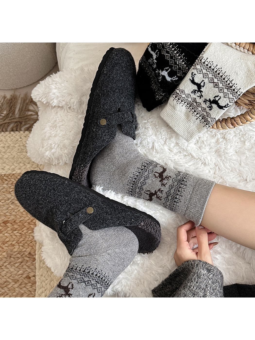 Light gray deer-pattern crew socks styled with charcoal clogs