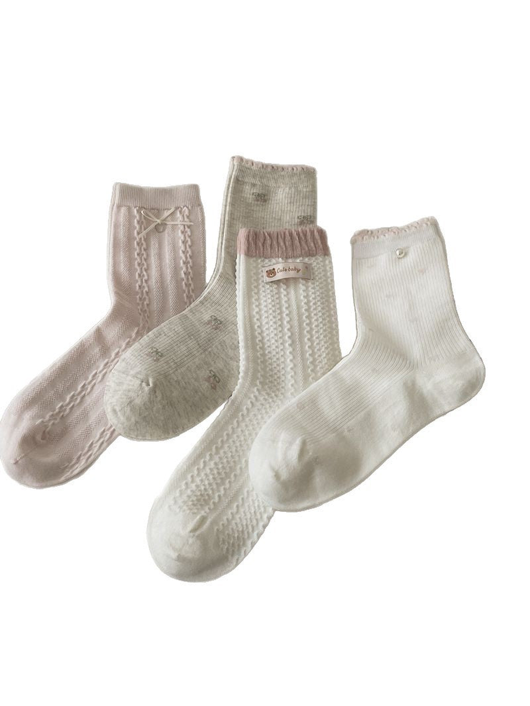 Four crew sock styles in pink, gray and white displayed together
