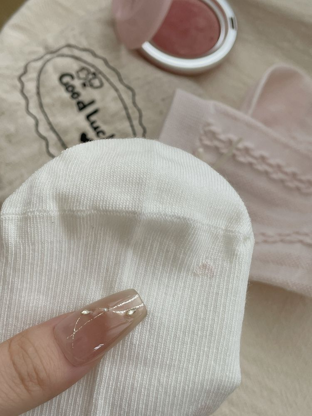 Close-up of fine vertical ribbing across the white sock toe and foot