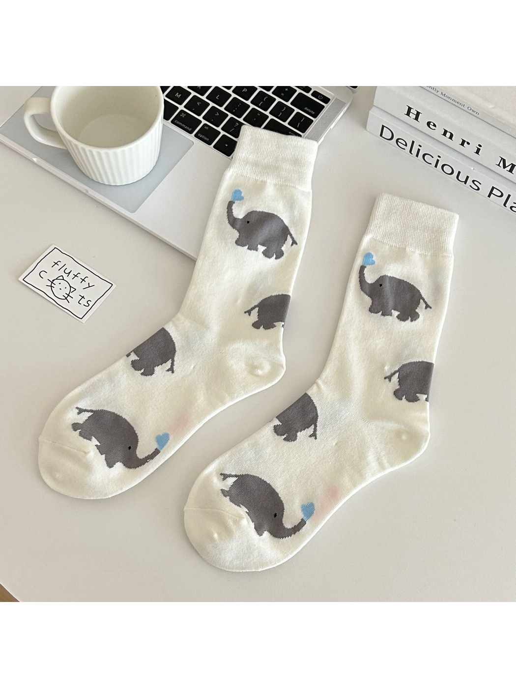 Ivory crew socks with gray elephant motifs and blue heart accents