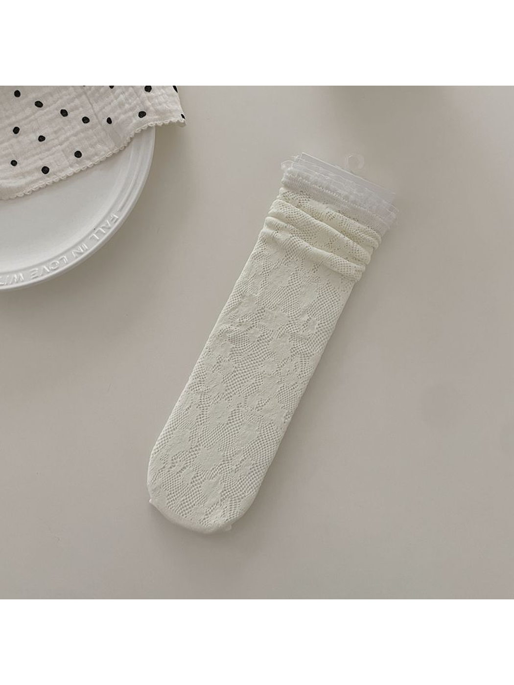 Ivory floral lace sock with ruffled cuff, flat display