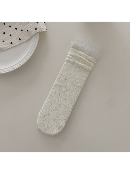 Ivory floral lace sock with ruffled cuff, flat display