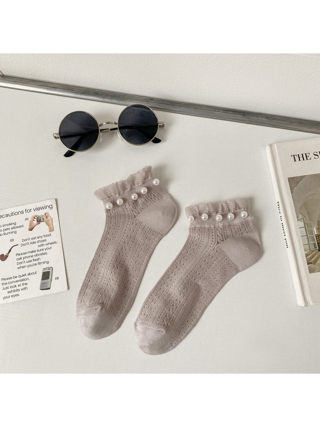 Gray ankle socks with ruffled cuffs and pearl-like bead trim