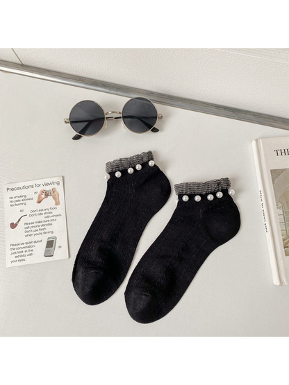 Black ankle socks with contrasting cuffs and pearl-like bead trim