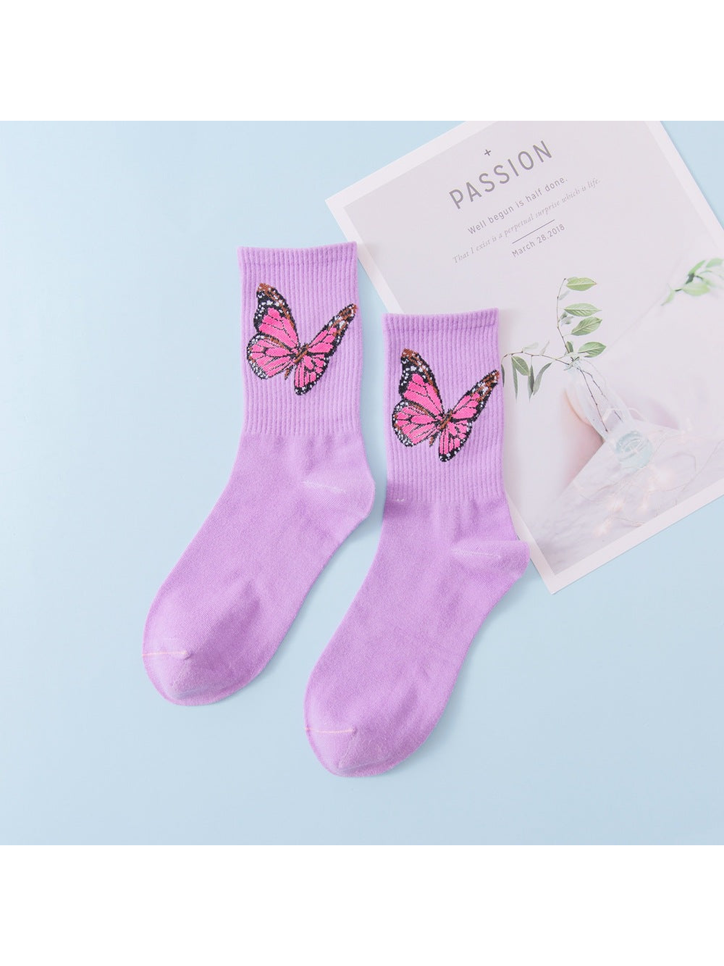 Light purple crew socks with pink butterfly motifs