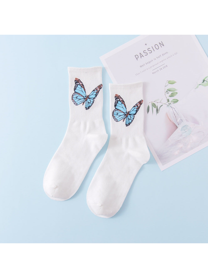 White crew socks with light blue butterfly motifs