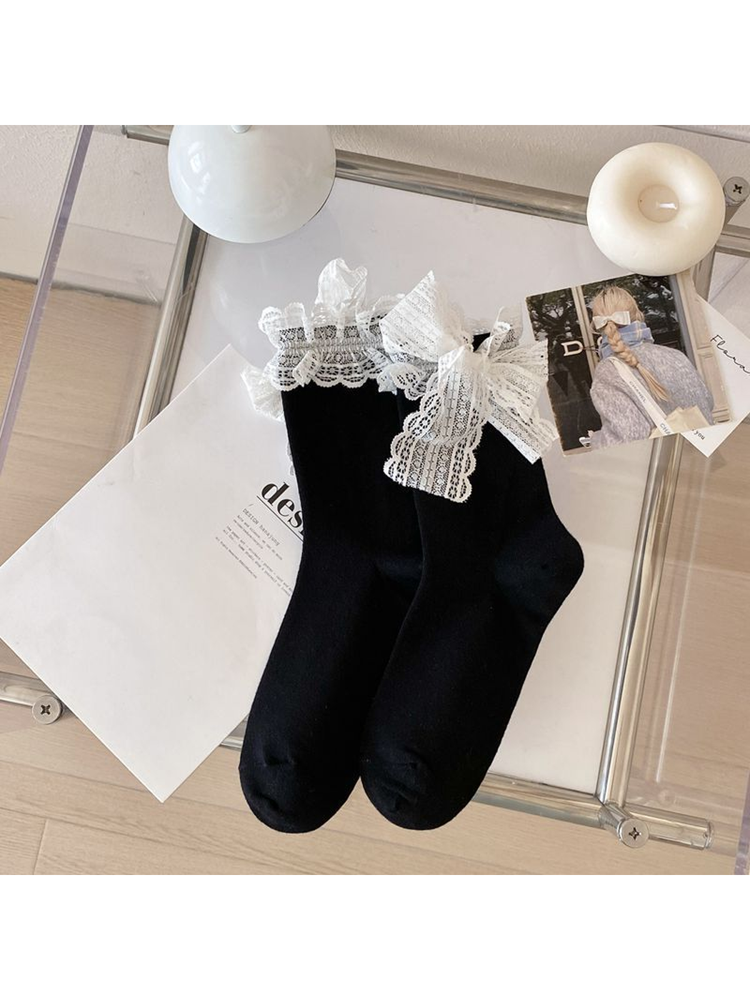 Black crew socks with white lace ruffle cuffs and bows