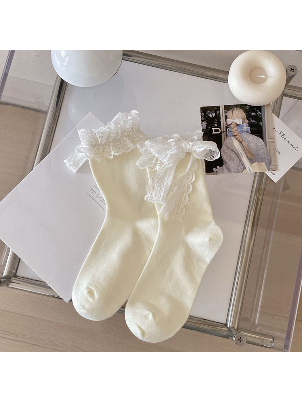 Ivory crew socks with white lace ruffle cuffs and bows