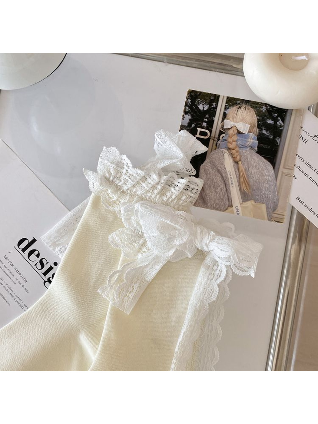 Close-up of the lace bow and layered scalloped ruffle cuff