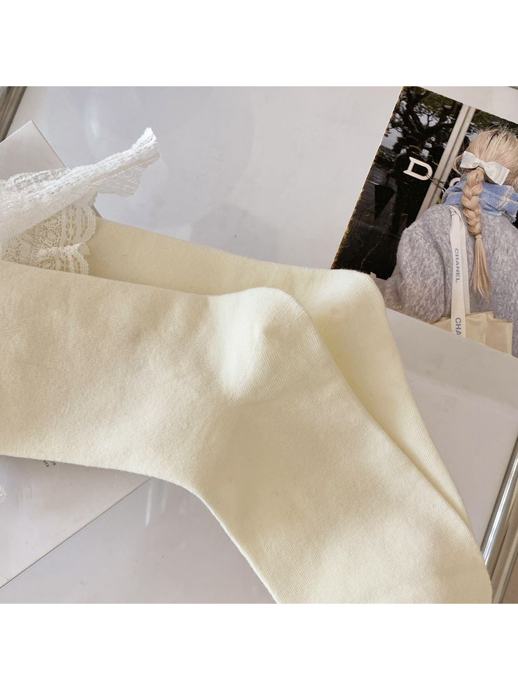 Close-up of the ivory sock's fine knit texture