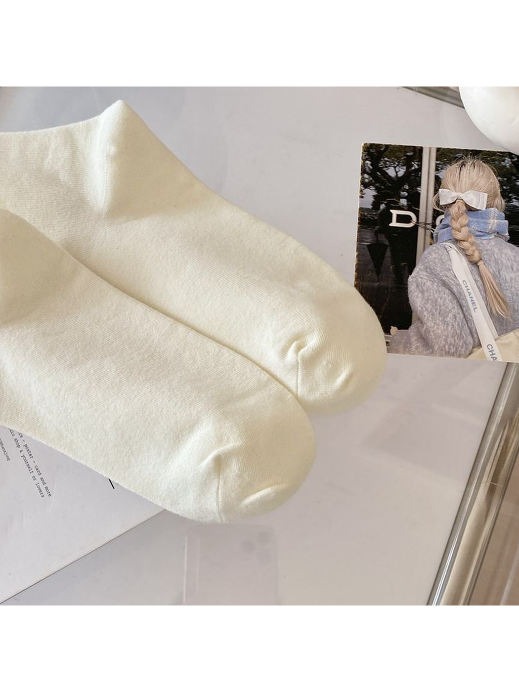 Close-up of the ivory socks' rounded toe seams