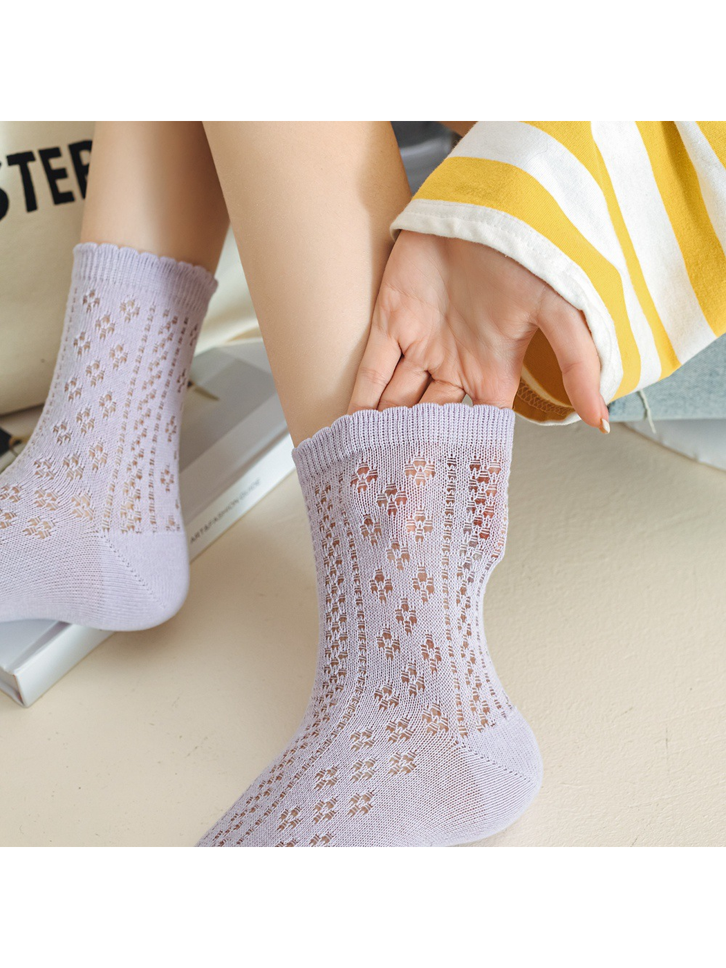 Close-up of the lavender floral pointelle pattern and ribbed cuff