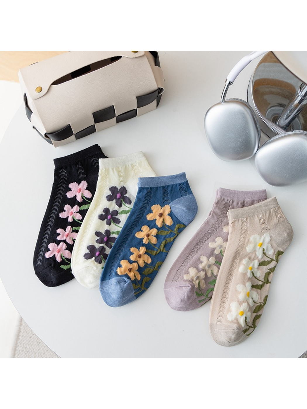 Five floral ankle sock styles displayed together