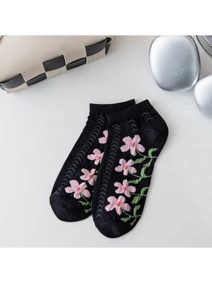 Black ankle socks with pink flowers and openwork knit panels