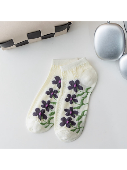 Ivory ankle socks with dark purple flowers and openwork knit panels