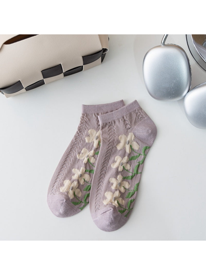 Light purple ankle socks with cream flowers and openwork knit panels