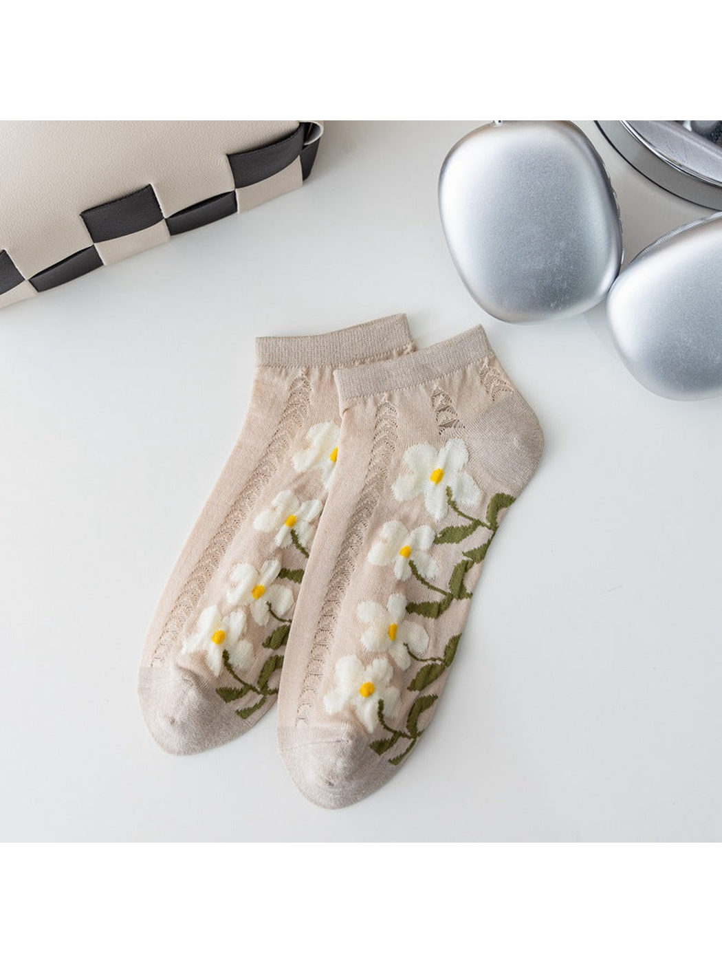 Beige ankle socks with white flowers and openwork knit panels