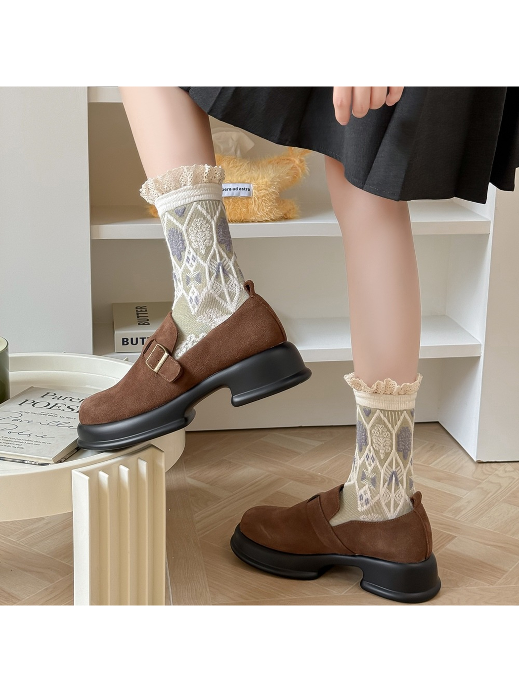Beige patterned socks styled with brown buckle shoes